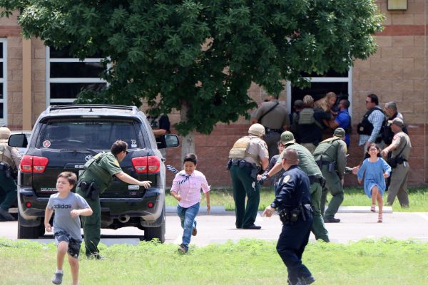 Students flee Robb Elementary School in the 2022 shooting in Uvalde, Texas